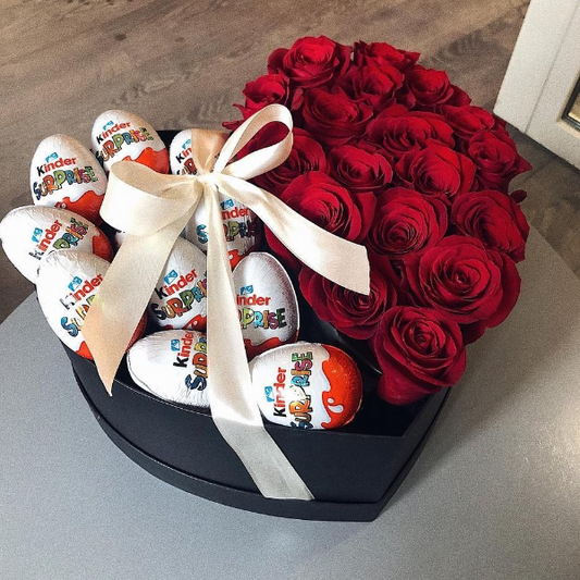 Caja con lazo de rosas rojas y huevos de chocolate