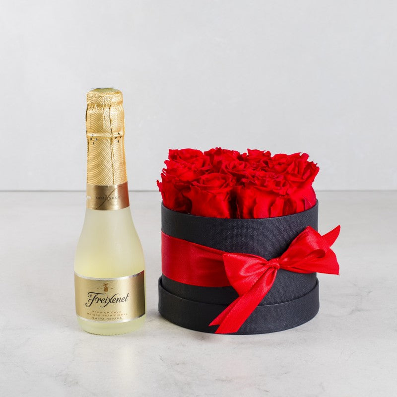 Caja pequeña de rosas rojas con Freixenet